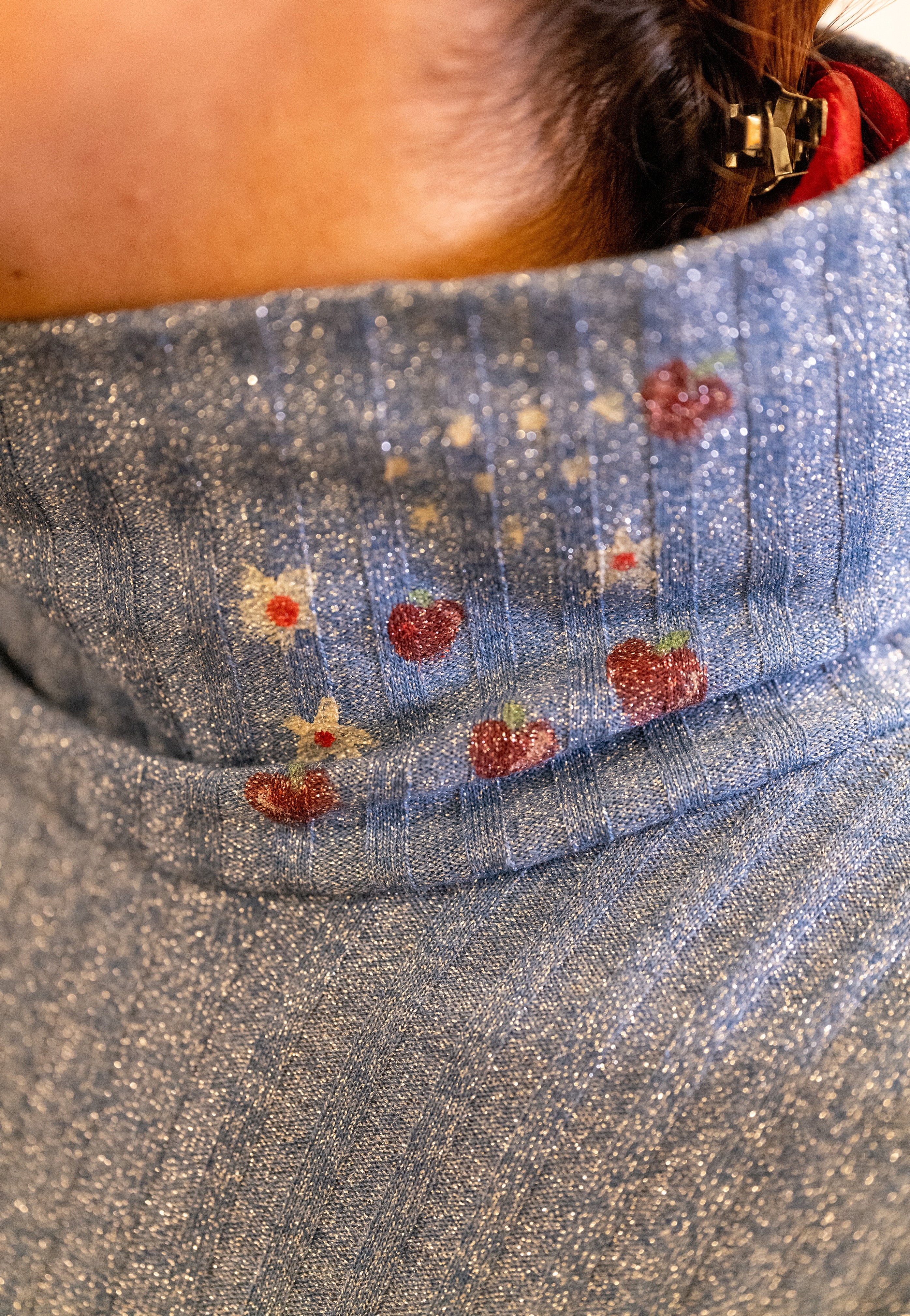 Polo neck baby donkey and its apples