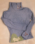 Polo neck baby donkey and its apples